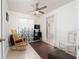 Bright bedroom featuring a ceiling fan, rocking chair and soothing natural light at 1105 Arrowsmith Ave, Orlando, FL 32809
