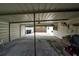Wide carport with concrete floor and metal supports, perfect for parking and outdoor projects at 1105 Arrowsmith Ave, Orlando, FL 32809