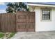 Metal gate providing secure access to the property and complimenting the home's exterior at 1105 Arrowsmith Ave, Orlando, FL 32809