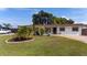 Well-maintained single-story home featuring a manicured front lawn and inviting curb appeal at 1105 Arrowsmith Ave, Orlando, FL 32809