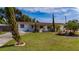 Inviting single-story home with well-maintained lawn, mature landscaping, and charming curb appeal at 1105 Arrowsmith Ave, Orlando, FL 32809