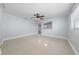 Bright, spacious living room featuring sleek tile flooring and modern ceiling fan at 1105 Arrowsmith Ave, Orlando, FL 32809