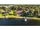 Expansive property with a lakefront view, a pool, and a private dock at 1351 N Classic Ct, Longwood, FL 32779