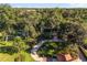 Lush landscaped property with mature trees and circular driveway at 1351 N Classic Ct, Longwood, FL 32779