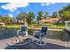 Inviting backyard with direct lake access, featuring a fire pit and comfortable seating for outdoor enjoyment at 1351 N Classic Ct, Longwood, FL 32779