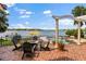 Outdoor patio with a view of the lake, a seating area, and a pool at 1351 N Classic Ct, Longwood, FL 32779
