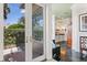 Stylish bathroom featuring marble tiling, a view to the outside garden and stylish vanity at 1351 N Classic Ct, Longwood, FL 32779