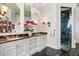 Luxurious bathroom with double sinks, marble countertops, and a walk-in shower at 1351 N Classic Ct, Longwood, FL 32779