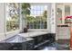 Luxurious bathroom with a soaking tub, large windows, and stylish marble flooring at 1351 N Classic Ct, Longwood, FL 32779
