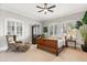 Cozy bedroom with natural light, a comfortable bed, classic furniture, and neutral decor at 1351 N Classic Ct, Longwood, FL 32779