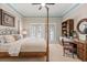 Well-lit bedroom features a four-poster bed, carpet floors, a decorative ceiling border, and built-in shelves at 1351 N Classic Ct, Longwood, FL 32779
