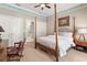 Comfortable bedroom with a four-poster bed, neutral walls, and ample closet space at 1351 N Classic Ct, Longwood, FL 32779