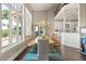 Bright dining room with large windows, an open floor plan, and a view of the backyard at 1351 N Classic Ct, Longwood, FL 32779