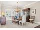 Bright dining room with plantation shutters, chandelier, and traditional furniture, perfect for Gathering gatherings at 1351 N Classic Ct, Longwood, FL 32779