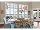 Elegant dining room with water views from large windows and decorative chandelier at 1351 N Classic Ct, Longwood, FL 32779