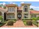 Elegant home with a red brick walkway, manicured shrubs, and stately facade at 1351 N Classic Ct, Longwood, FL 32779