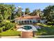 Stunning backyard showcasing a luxurious pool, patio area, beautifully manicured landscaping and brick staircase at 1351 N Classic Ct, Longwood, FL 32779