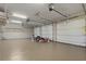 Spacious three-car garage featuring ample storage and overhead lighting at 1351 N Classic Ct, Longwood, FL 32779