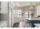 Gourmet kitchen features hardwood floors, marble counters, a center island, and stainless appliances at 1351 N Classic Ct, Longwood, FL 32779