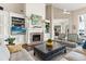 Bright and airy living room with a fireplace, built-in shelves and large windows at 1351 N Classic Ct, Longwood, FL 32779