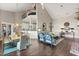 Open-concept living space with hardwood floors, a dining area, and a cozy sitting area at 1351 N Classic Ct, Longwood, FL 32779
