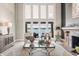 Bright living room with lake views through large windows and a fireplace at 1351 N Classic Ct, Longwood, FL 32779