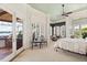 Main bedroom with views of the lake, shutters, and access to the outdoor kitchen at 1351 N Classic Ct, Longwood, FL 32779