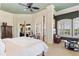 Bright main bedroom with neutral decor, windows with shutters, and views of the lake at 1351 N Classic Ct, Longwood, FL 32779