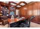 Richly appointed office with custom bookshelves, wood paneling, and a classic executive desk at 1351 N Classic Ct, Longwood, FL 32779