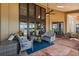 Inviting covered patio with comfortable seating, a ceiling fan, and scenic views of the lake and surrounding landscape at 1351 N Classic Ct, Longwood, FL 32779