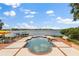 Waterfront home featuring a pool and spa overlooking a beautiful lake, offering a serene and luxurious retreat at 1351 N Classic Ct, Longwood, FL 32779