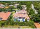 Stunning aerial view of backyard with private pool and hot tub surrounded by lush landscaping at 1517 Edenhall Pt, Lake Mary, FL 32746
