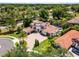 Gorgeous home boasts a circular driveway, meticulous landscaping, and a grand facade at 1517 Edenhall Pt, Lake Mary, FL 32746