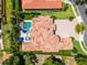 Aerial view of the home's tile roof, pool, and well-manicured grounds at 1517 Edenhall Pt, Lake Mary, FL 32746
