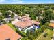 Bird's-eye view of the property featuring a pool, covered patio, and well-maintained grounds at 1517 Edenhall Pt, Lake Mary, FL 32746