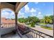 A gorgeous balcony looks out onto the beautifully landscaped front yard and neighborhood at 1517 Edenhall Pt, Lake Mary, FL 32746