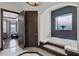 Well-lit bathroom with a soaking tub, wood accent wall, and views from the window at 1517 Edenhall Pt, Lake Mary, FL 32746