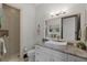 Bathroom features modern vessel sink, marble countertops, and tiled shower at 1517 Edenhall Pt, Lake Mary, FL 32746