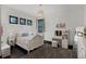 Bedroom boasts a decorative light fixture, vanity and dark hardwood floors at 1517 Edenhall Pt, Lake Mary, FL 32746