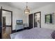 Bedroom features hardwood floors, a dresser and an ensuite bathroom at 1517 Edenhall Pt, Lake Mary, FL 32746