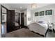 Bedroom offers hardwood floors, decorative windows and a modern light fixture at 1517 Edenhall Pt, Lake Mary, FL 32746