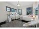 Bright bedroom featuring a vanity, plush chair and white and black furniture at 1517 Edenhall Pt, Lake Mary, FL 32746