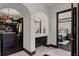 Bright bathroom with an arched doorway leading to the bedroom and walk-in closet at 1517 Edenhall Pt, Lake Mary, FL 32746