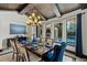 Formal dining area with designer lighting, views of the pool, and seating for eight at 1517 Edenhall Pt, Lake Mary, FL 32746