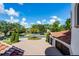 Long paver driveway leading to the spacious three-car garage of this residence at 1517 Edenhall Pt, Lake Mary, FL 32746