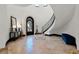 Elegant foyer with a curved staircase, ornate front door, and sophisticated tile flooring at 1517 Edenhall Pt, Lake Mary, FL 32746