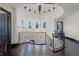 Elegant hallway with a curved wrought iron railing and a multi-window view at 1517 Edenhall Pt, Lake Mary, FL 32746