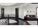 Hallway with hardwood floors, metal railing, and decorative lighting at 1517 Edenhall Pt, Lake Mary, FL 32746