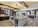 Open-concept kitchen featuring island seating, stainless steel appliances, and seamless flow into the living area at 1517 Edenhall Pt, Lake Mary, FL 32746