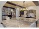 Updated kitchen featuring stainless steel appliances, a large island with seating, and stylish lighting at 1517 Edenhall Pt, Lake Mary, FL 32746